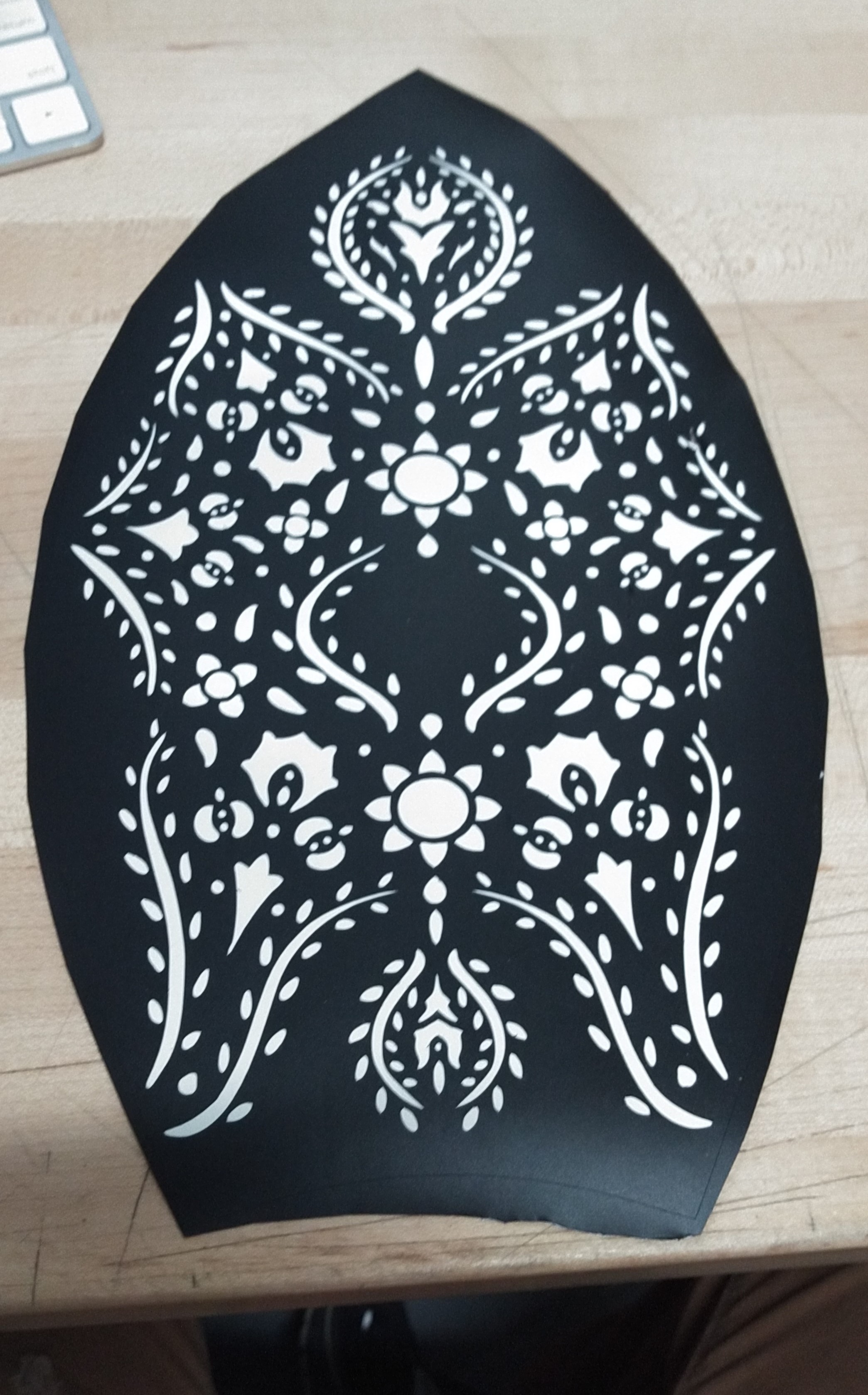 A vinyl sheet with ornamental patterns cut into it