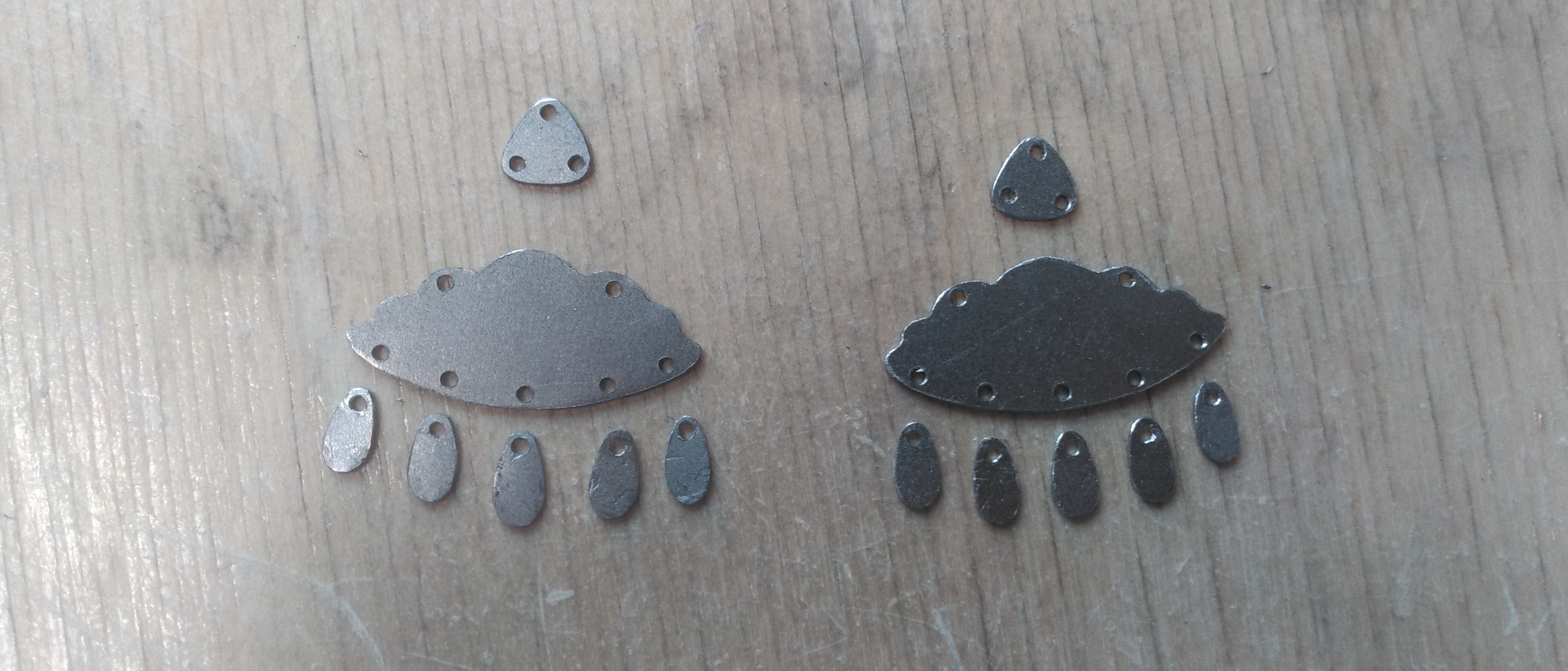 Sheet steel forms in the shape of rain clouds