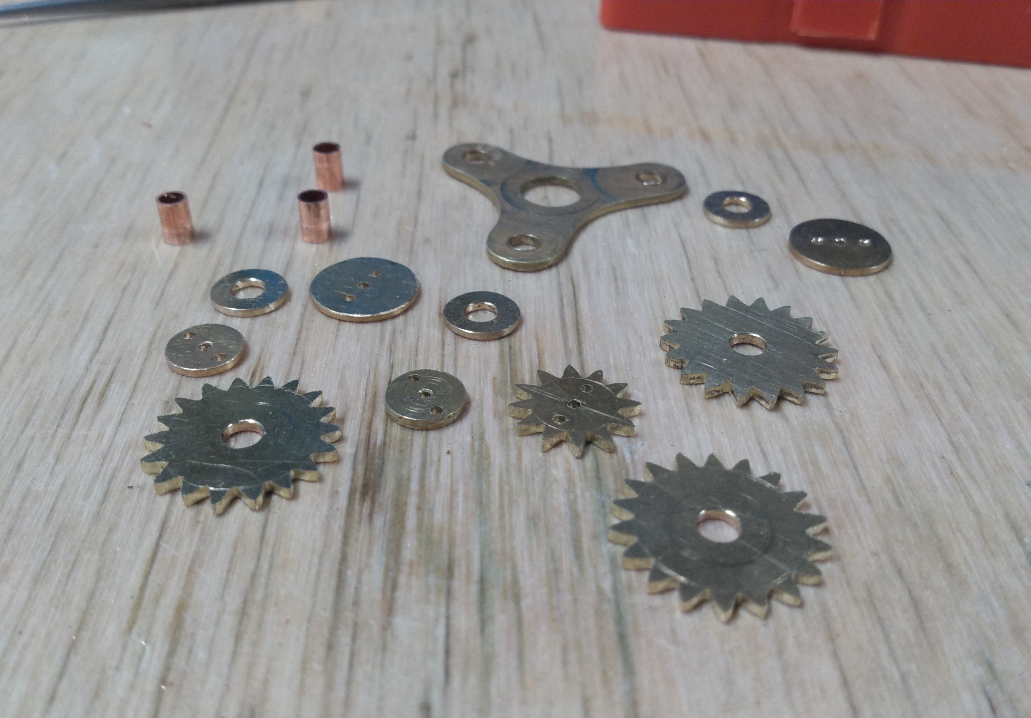 brass and copper components, including gears, washers, and bearings