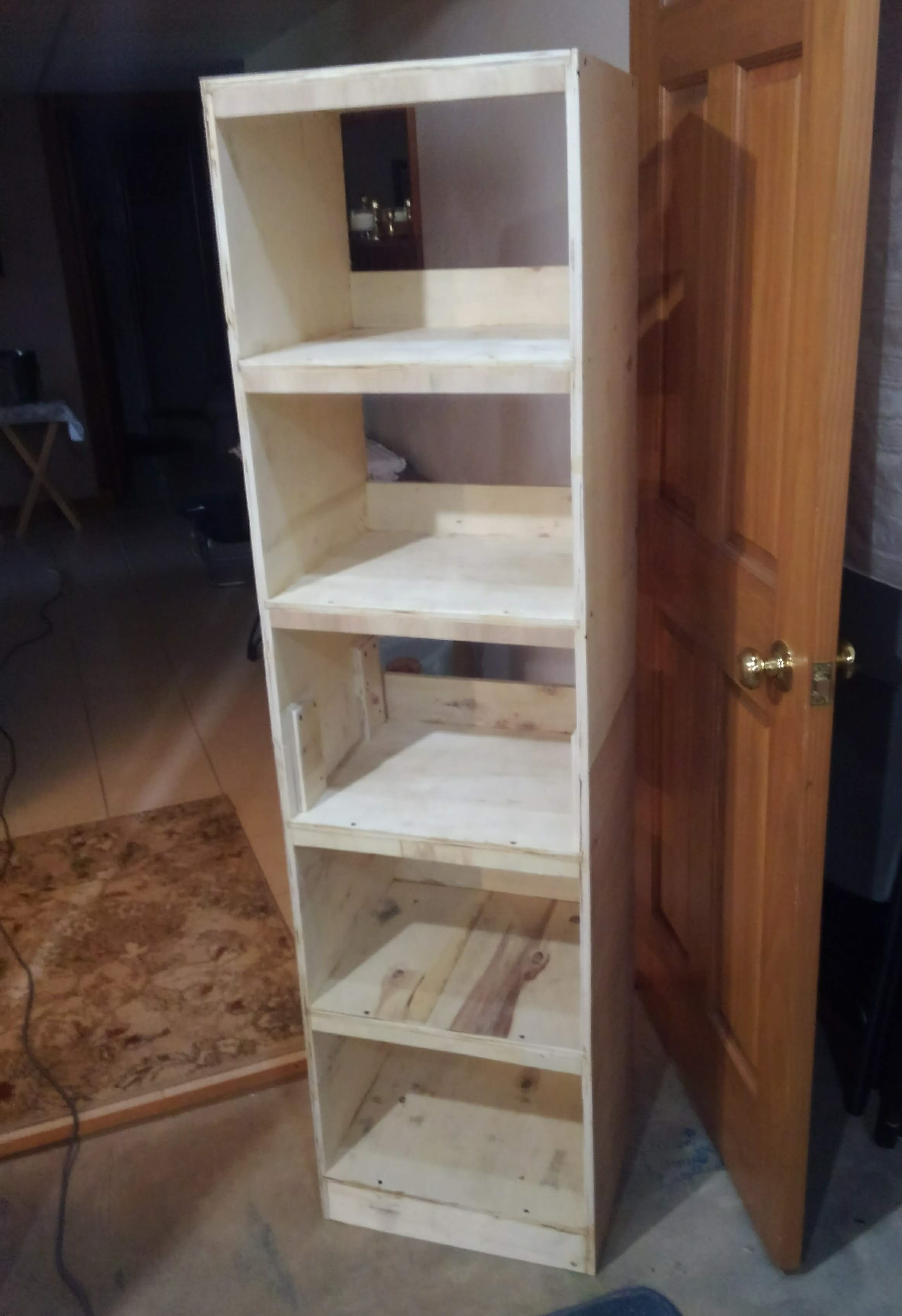 a tall, unfinished shelf