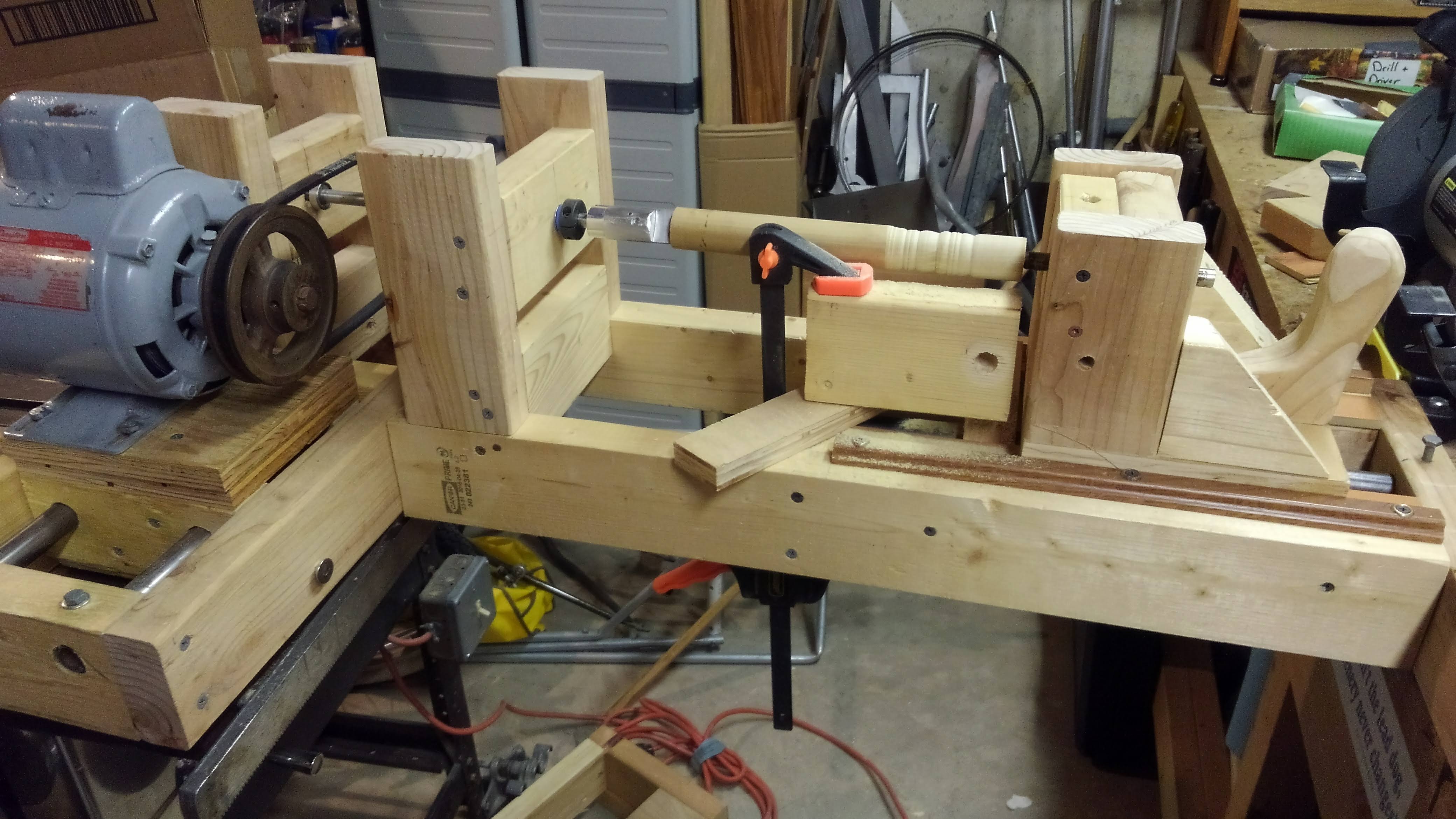 a hobby lathe set up with a makeshift toolrest