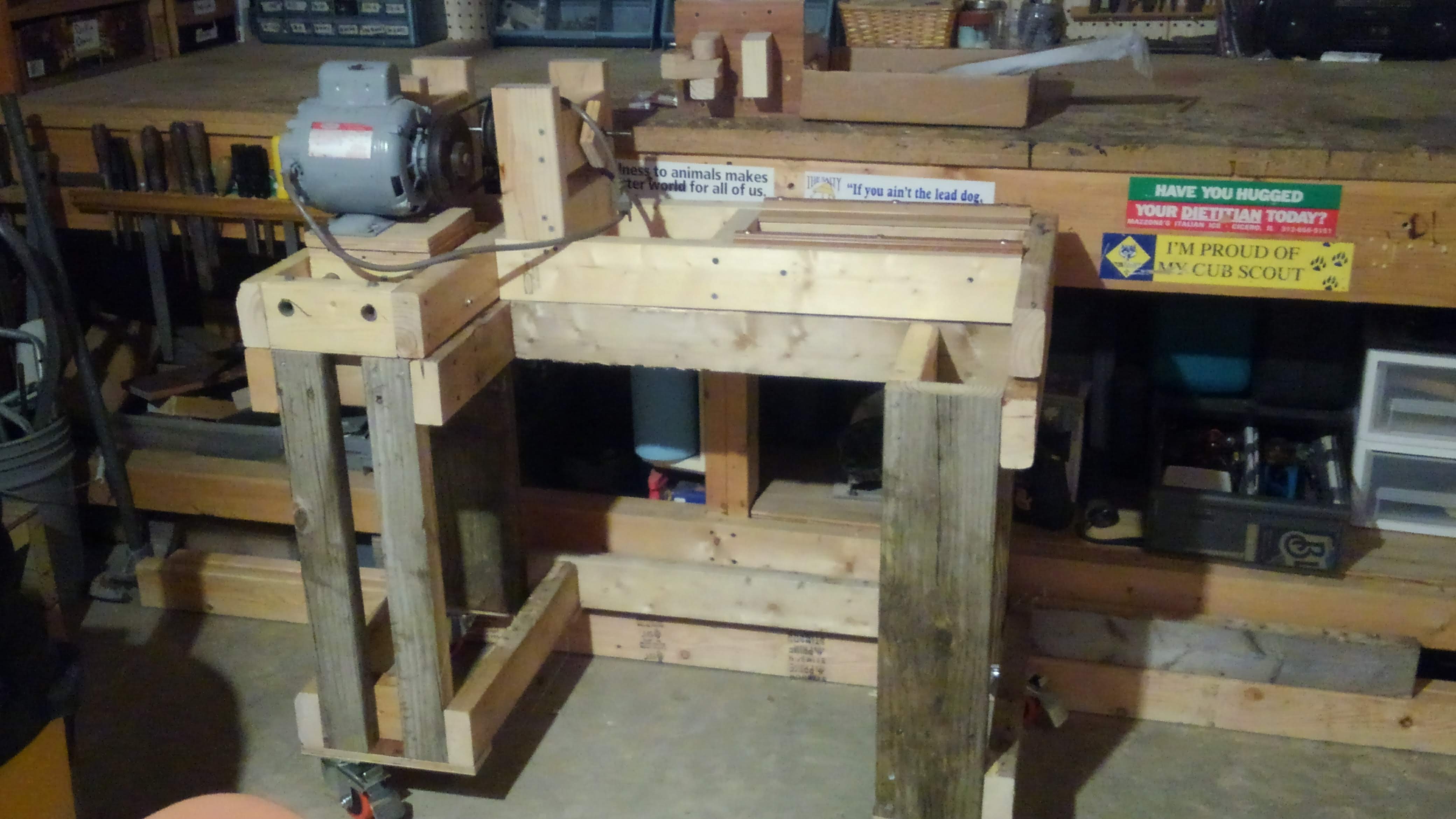 a hobby lathe on a wood stand