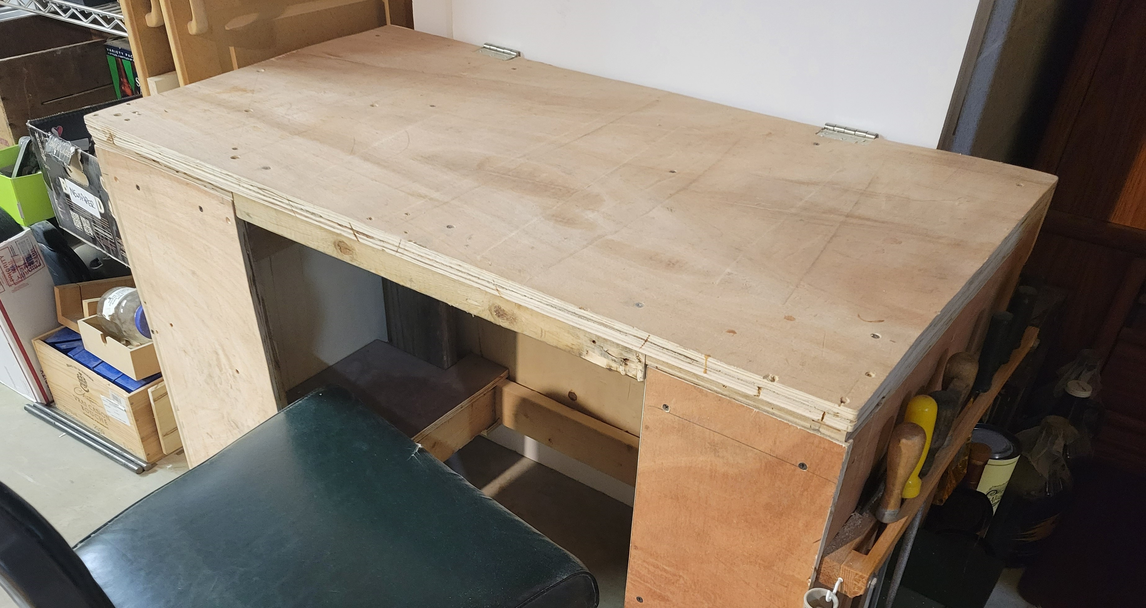 a rolling workbench with a plywood top
