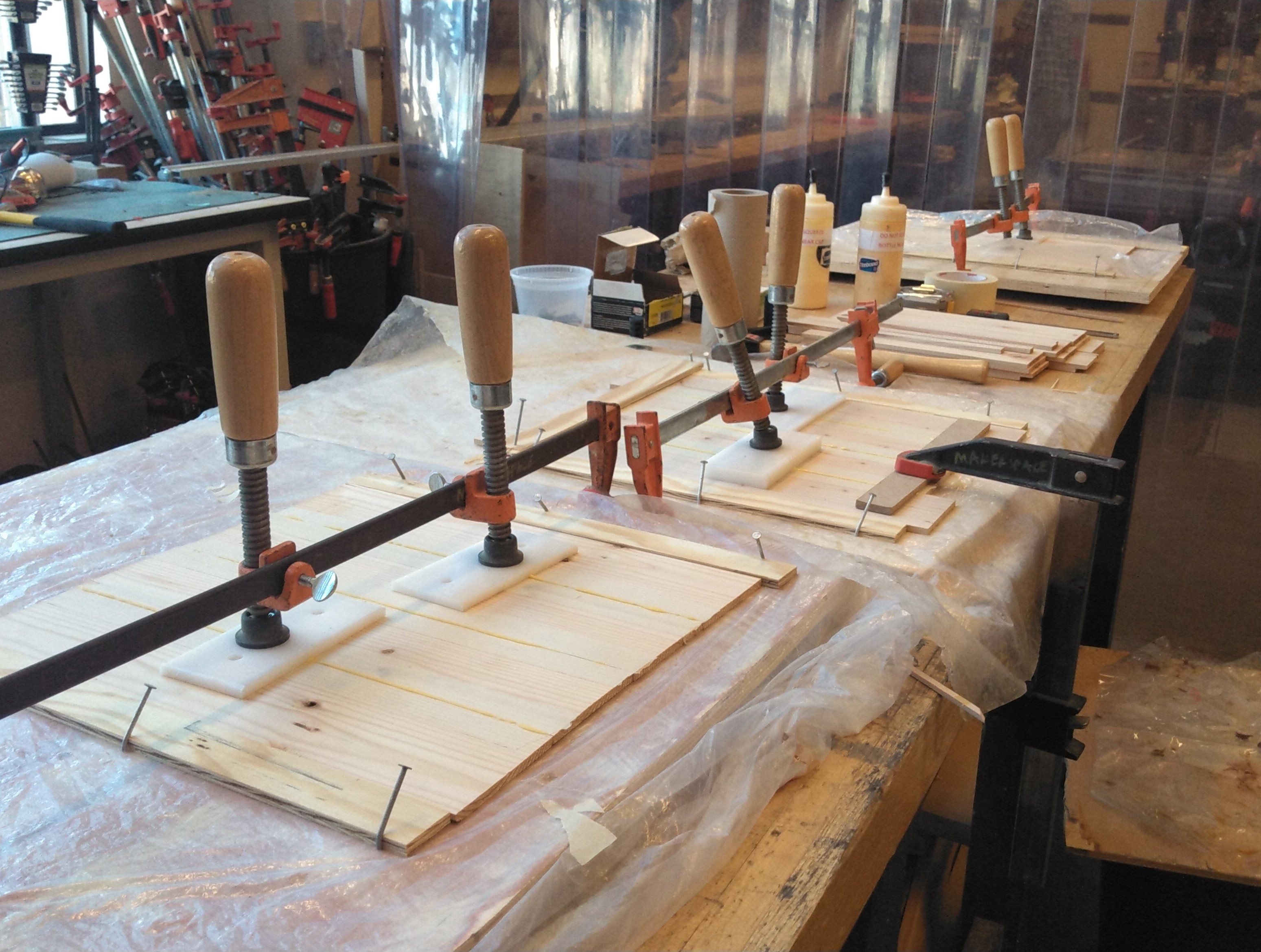 panels of wood being glued up