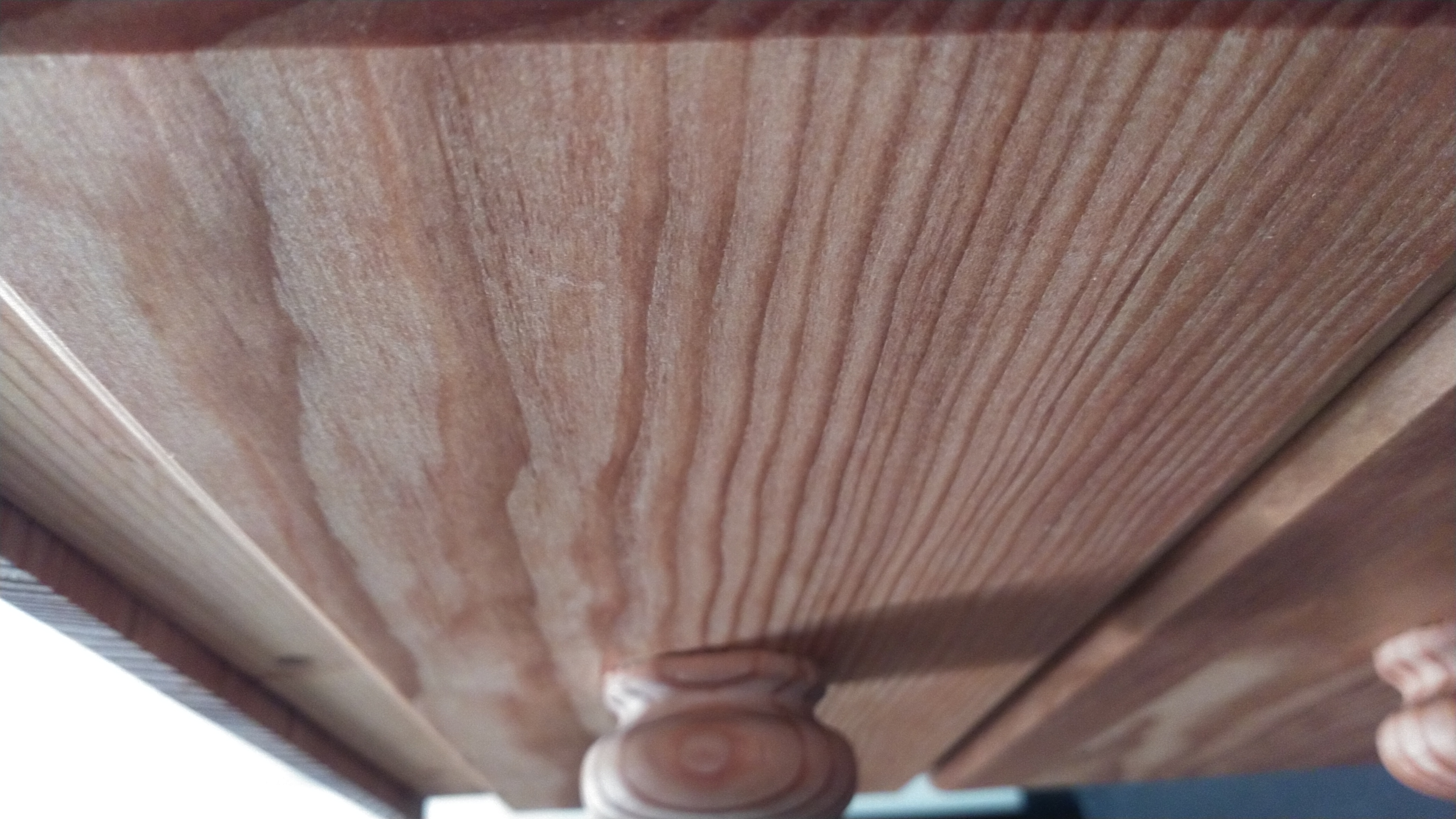 A close up image of a drawer front that shows the wood grain