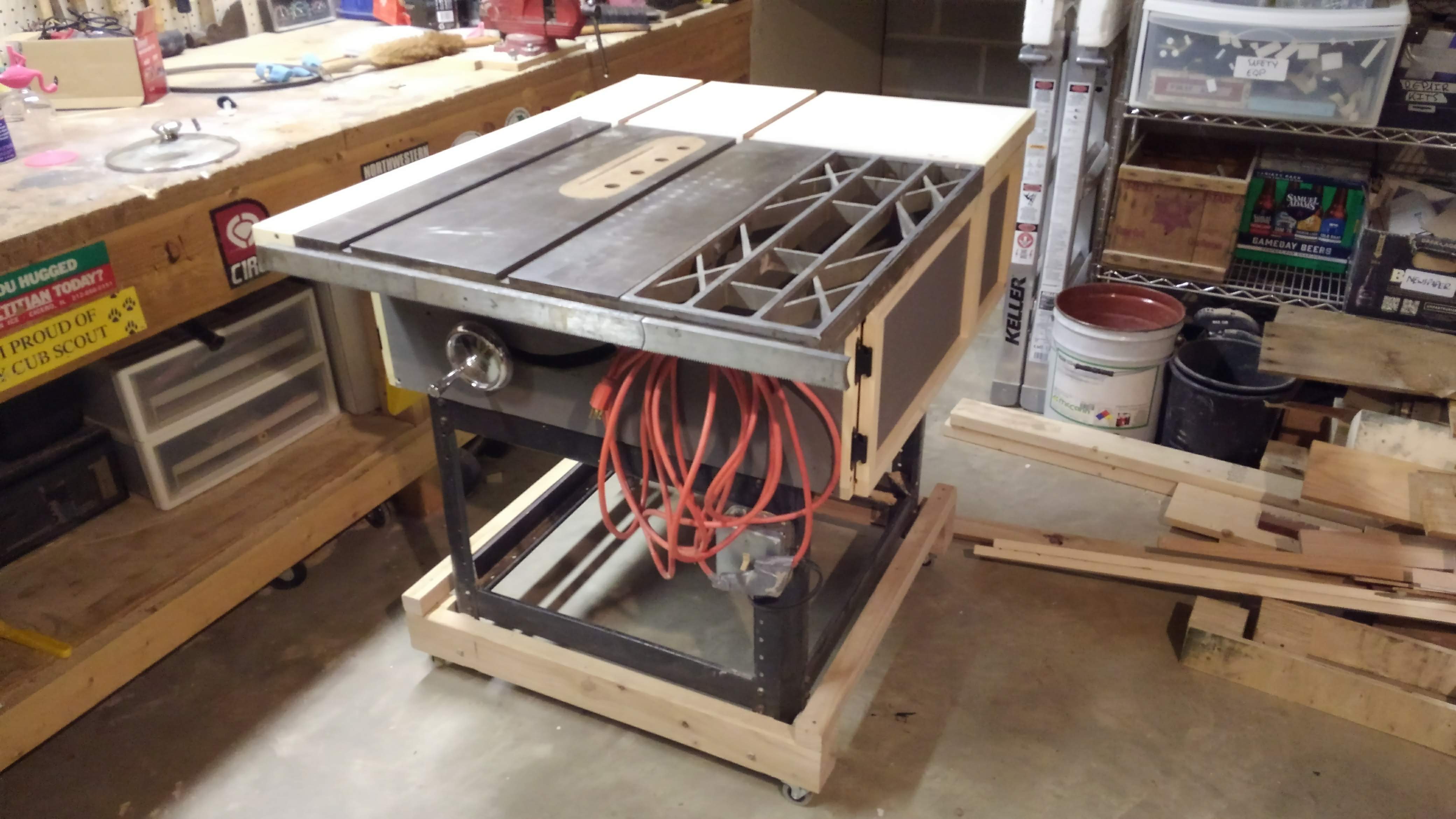 A table saw with an outfeed extension and cabinets