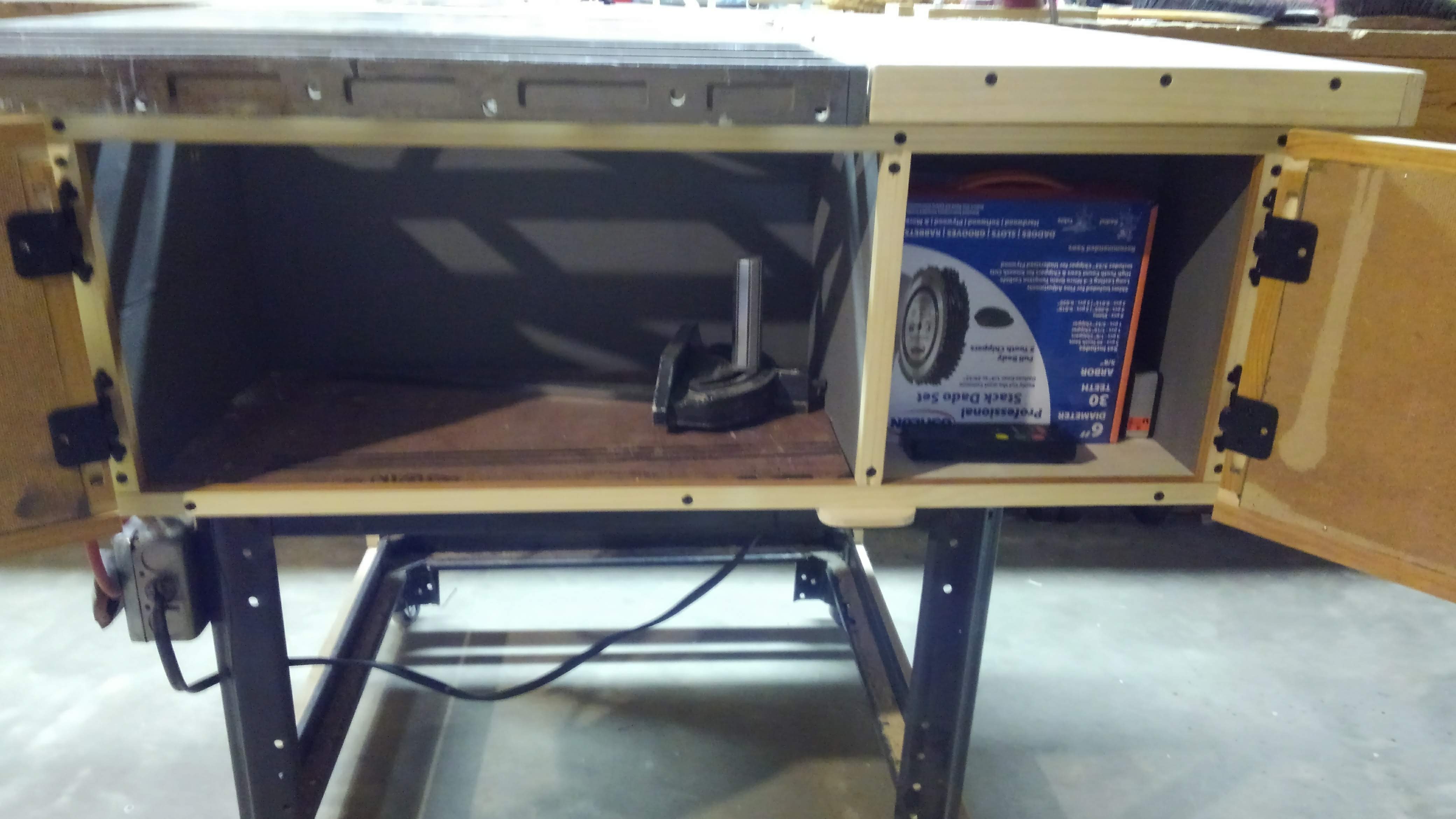 A cabinet with saw equipment built into a table saw
