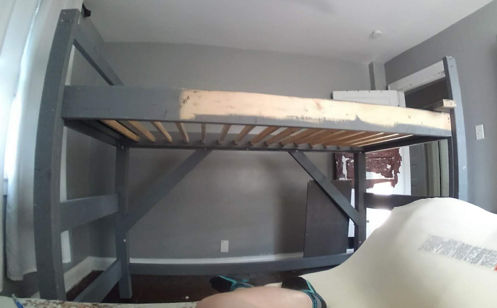 A lofted bed mid-way through construction