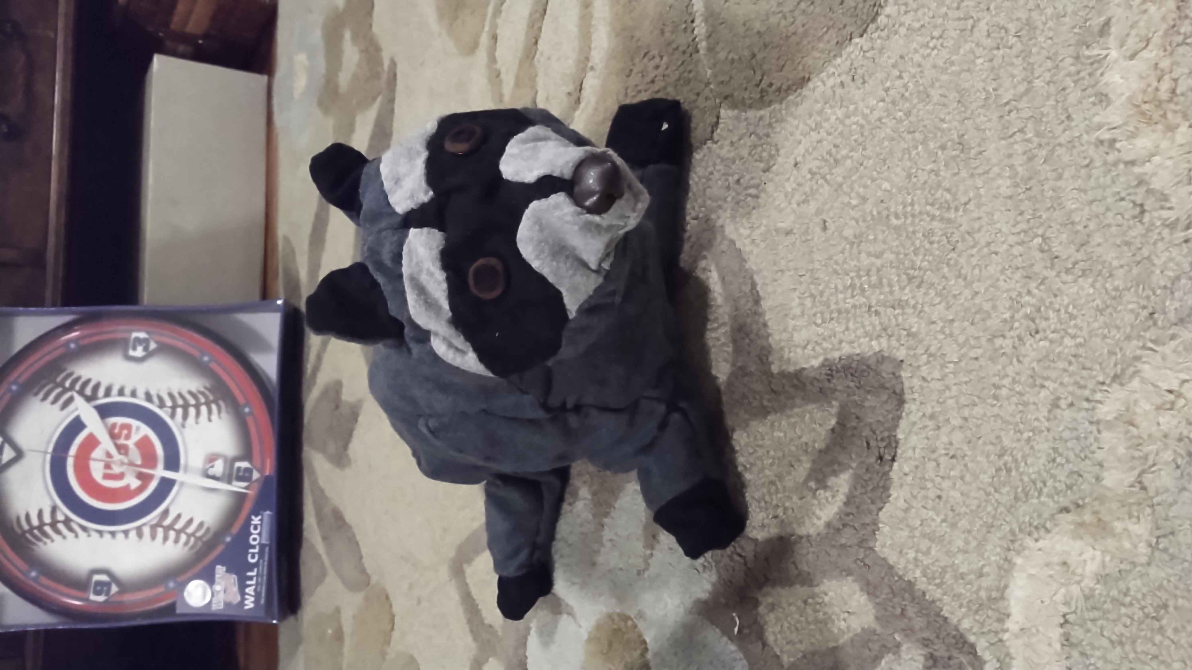 A partially sewn stuffed raccoon, right side out