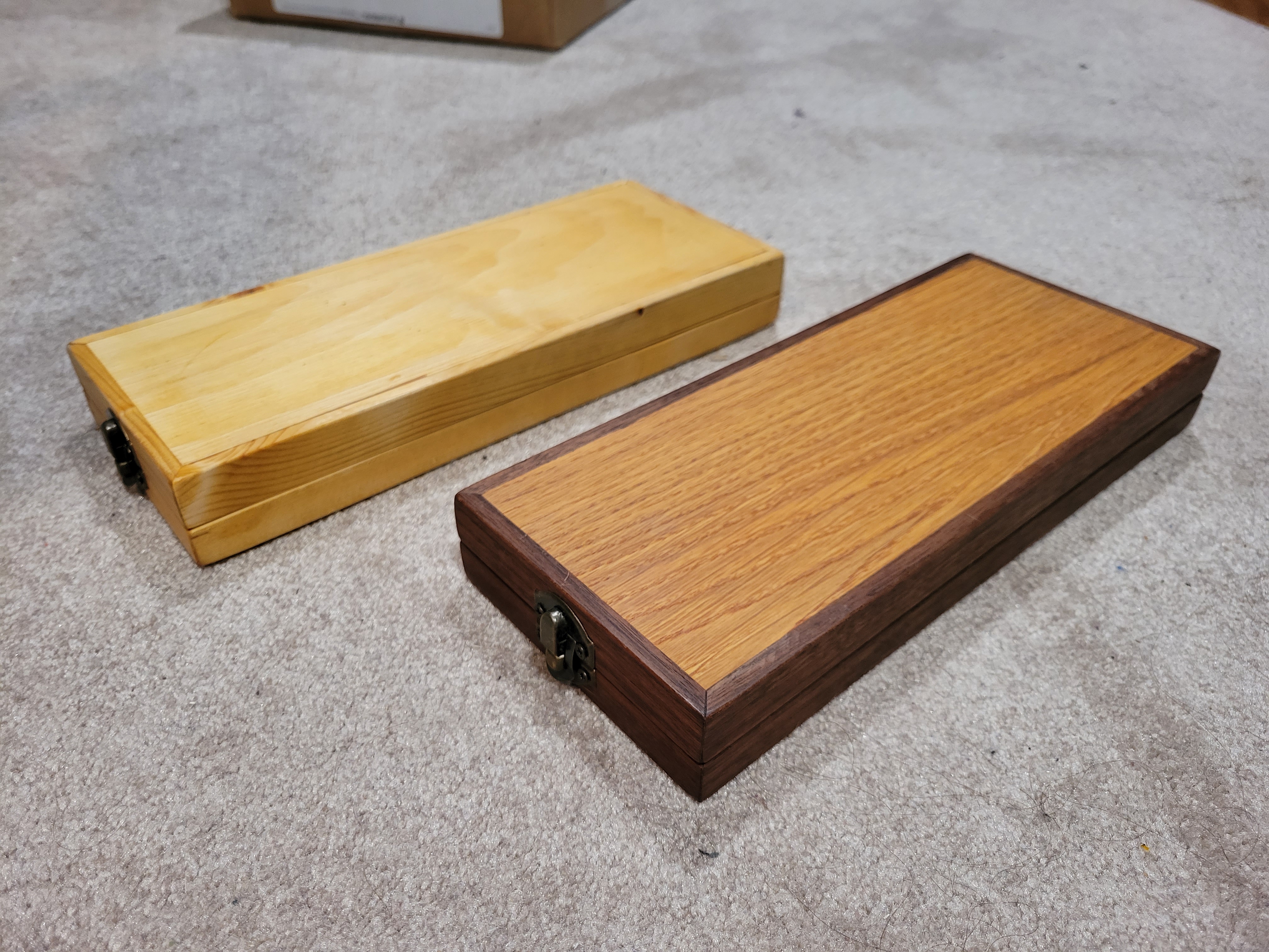 two boxes, one made of pine, the other of oak and walnut